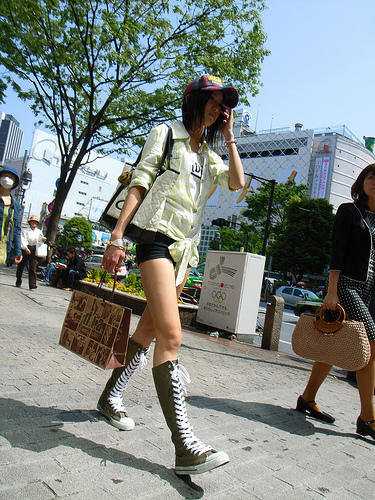 A chic girl strides confidently through Shibuya